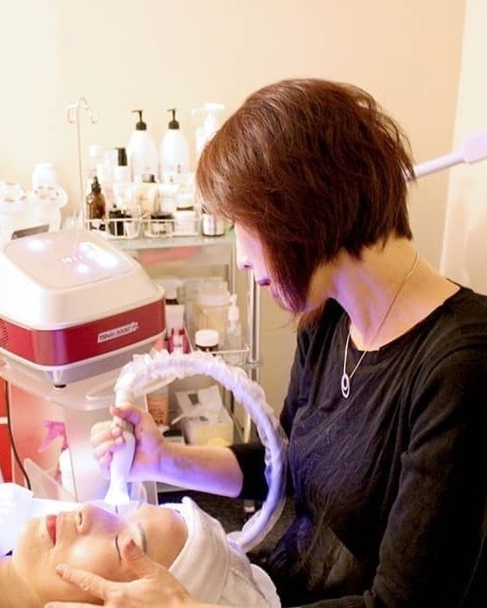 Christine doing facial service at Your Face Lab