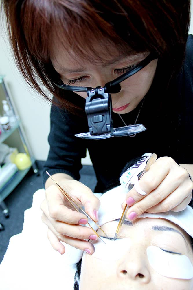 Christine performing microblading services on a customer at Your Face Lab